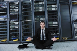business man practice yoga at network server room