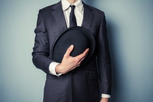 Man holding a bowler hat